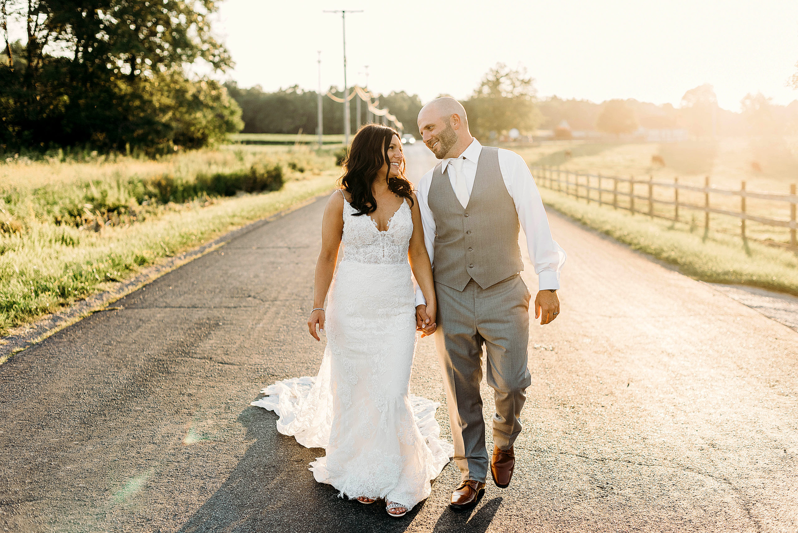 Bride and Groom walking in the road at Rustic Acres Farm