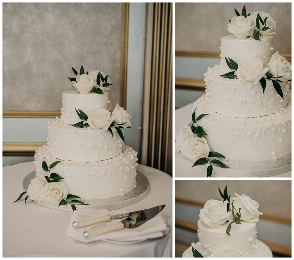 Wedding cake displayed at the reception venue, adorned with floral decorations and set against a backdrop of the LeMont’s stunning views.