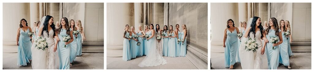 Bride and bridesmaids posing together in elegant attire at the Mellon Institute, showcasing their coordinated looks against the venue’s grand backdrop.